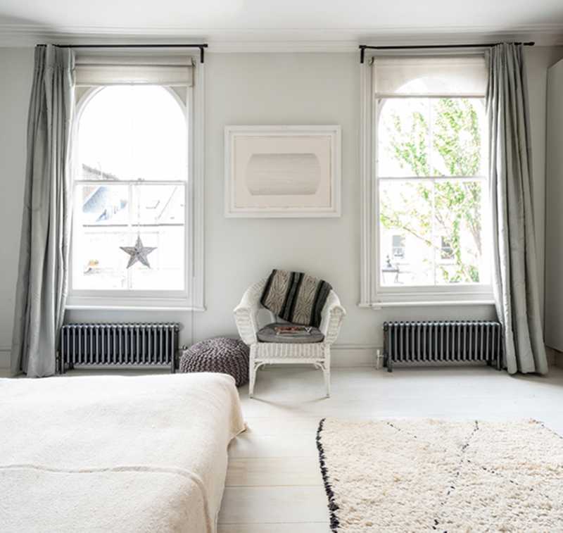 Bisque traditional grey radiators set under a bedroom window